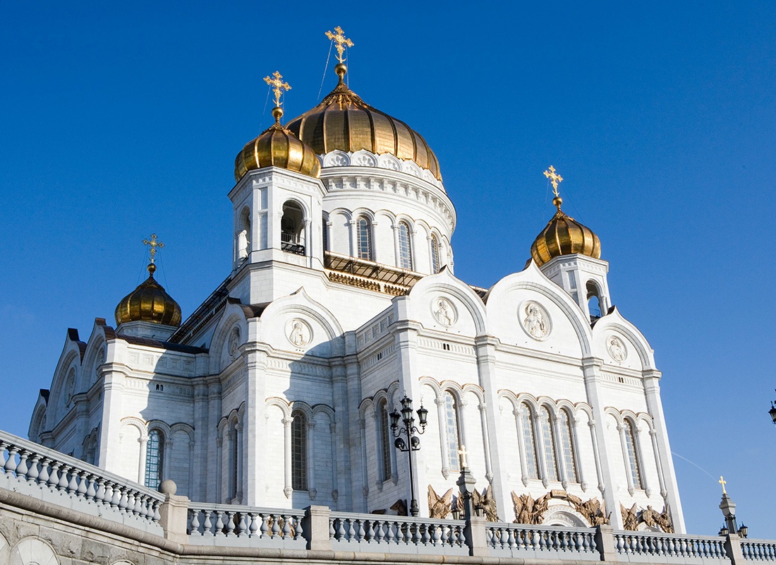 Church Insurance - Exterior View of an Orthodox Christian Church Against a Bright Blue Sky